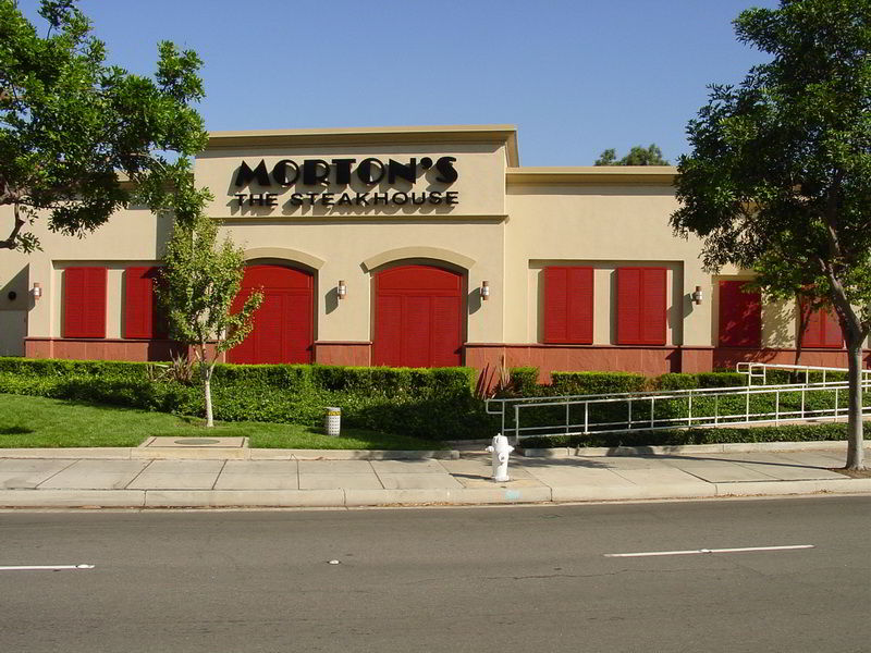 Morton's restaurant with red shutters